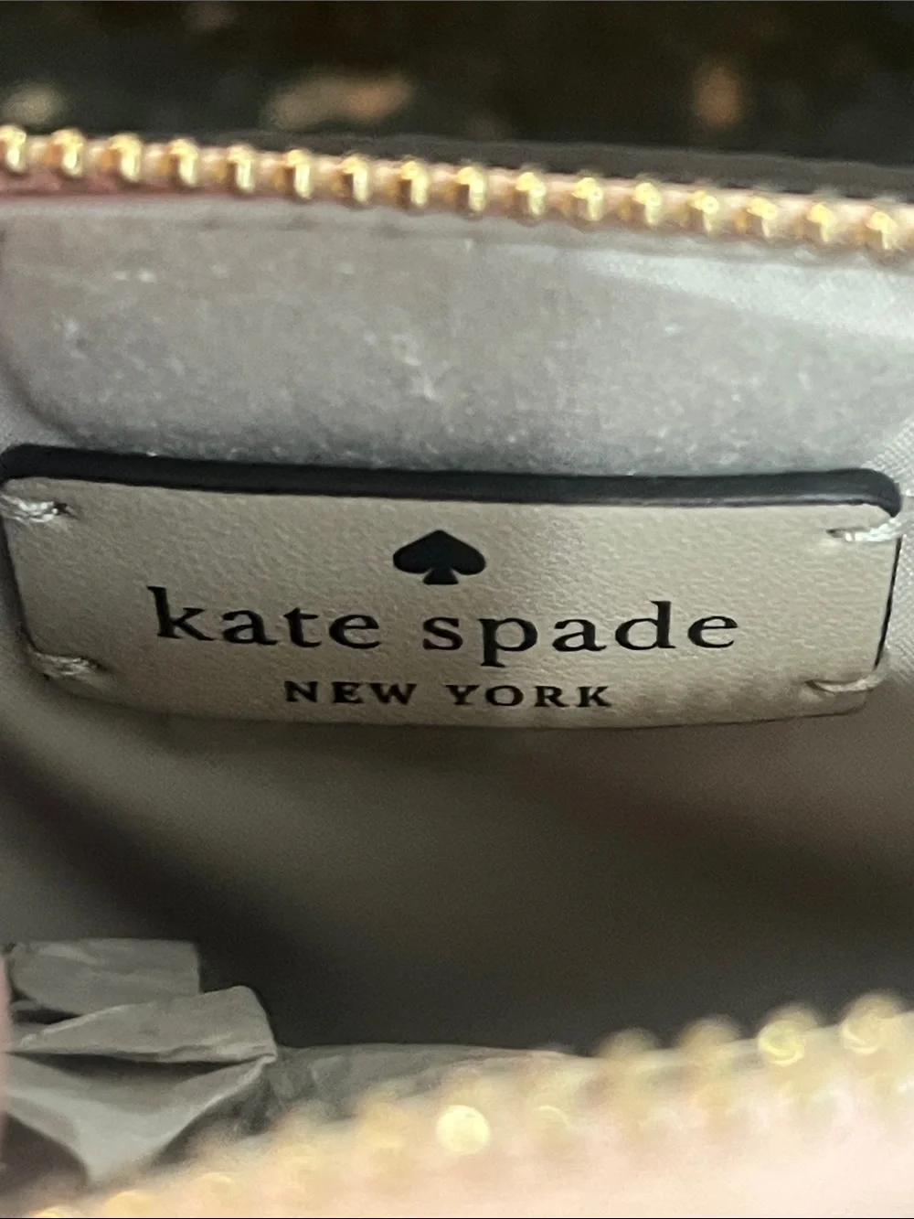 Kate Spade glittery rose gold cosmetic pouch